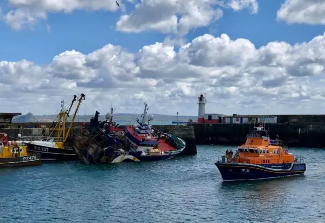 Trawler keels over. Pic: Penlee Lifeboat/Facebook