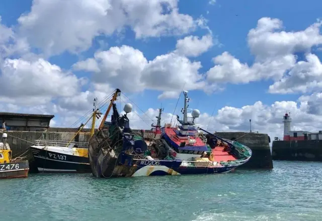 Trawler heeling over. Pic: Penlee Lifeboat/Facebook