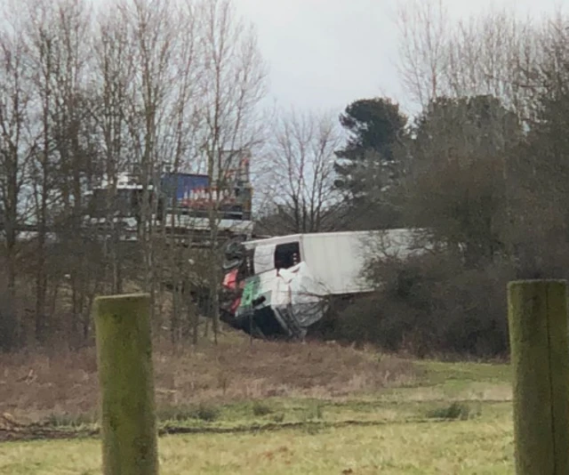 Crashed lorry on its side on the M25