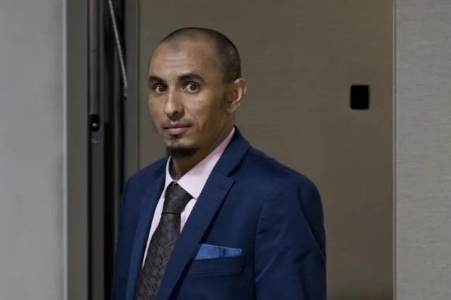 Al Hassan Ag Abdoul Aziz Ag Mohamed Ag Mahmoud enters the court room for his initial appearance on charges of war crimes and crimes against humanity at the International Criminal Court in The Hague, Netherlands, 04 April 2018.