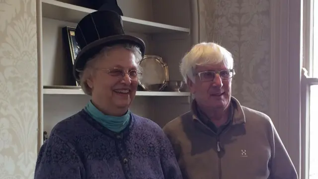 Deborah trying on the hat