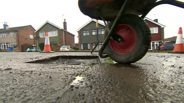 Pot hole gets filled in