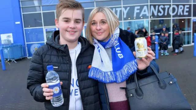 Football fans with drinks