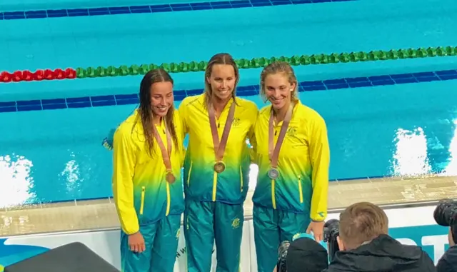 Australian swimmers on podium after women's 100m butterfly