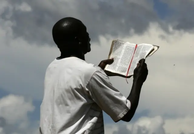 A street preacher reads the Bible aloud on April 9, 2012 in Lilongwe.