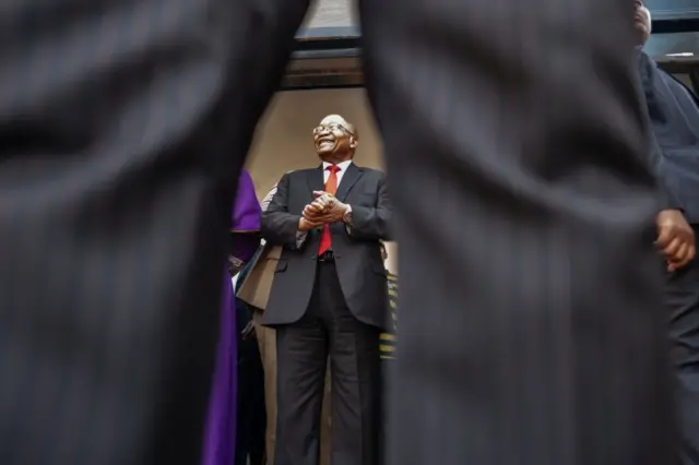 Jacob Zuma greets a crowd of supporters before addressing them outside the KwaZulu-Natal High Court in Durban on April 6, 2018