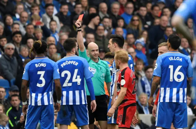 Davy Propper is shown the red card