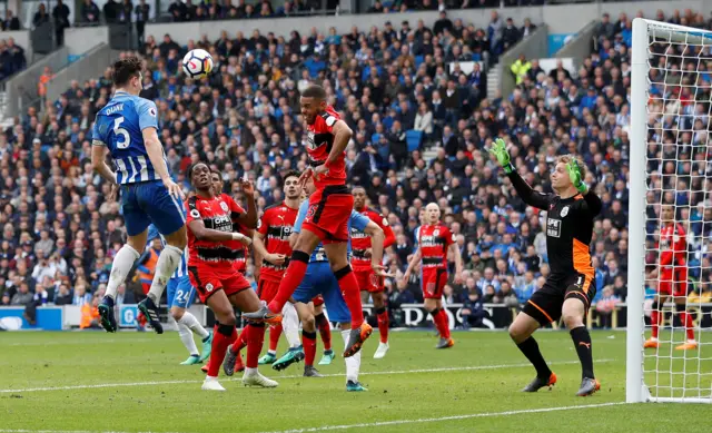 Lewis Dunk goes to head the ball