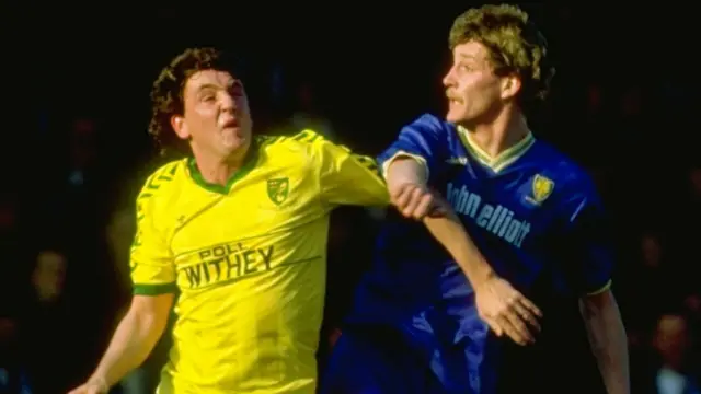 Steve Bruce (left) in action for Norwich City against Wimbledon