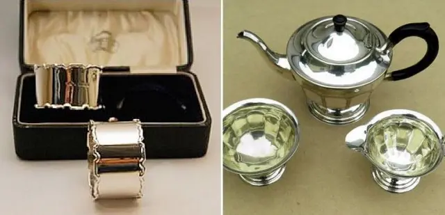 a silver tea set and silver napkin rings