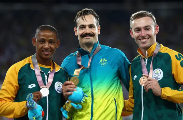 Silver medalist Dyan Buis of South Africa, gold medalist Evan O’Hanlon of and bronze medalist Charl du Toit of South Africa pose during the medal ceremony