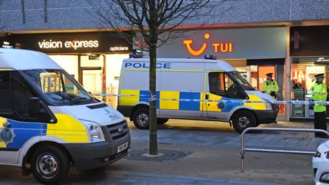 Police at the Tui store in Southport