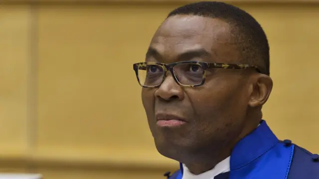 Judge Chile Eboe-Osuji sits in the courtroom before the trial against Kenya's Deputy President William Ruto and Joshua Arap Sang at the International Criminal Court (ICC) in The Hague on September 10, 2013