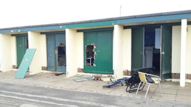 Damaged beach huts