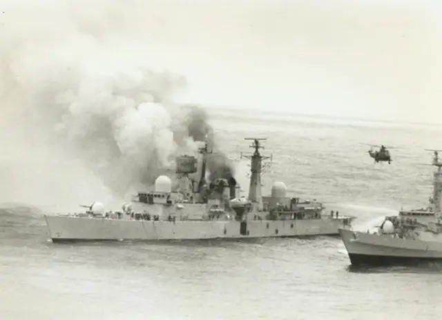 The second HMS Sheffield on fire after a missile strike during the Falklands War