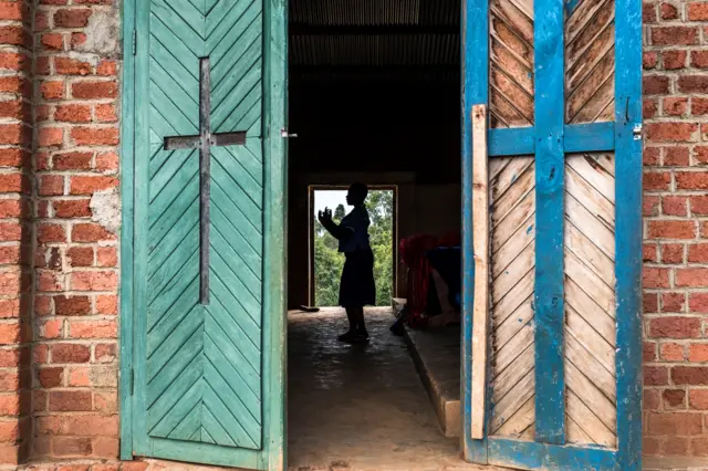 A youngster sings inside the Mulamo Baptist Church in the Kyala neighbourhood of Butembo, North Kivu province, on November 10, 2016.