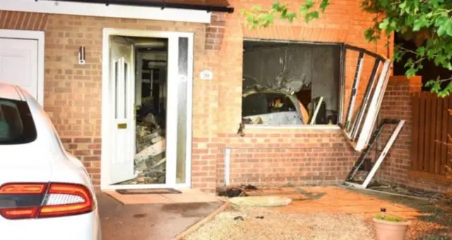 The car ended up in the front room of the Garnett's house