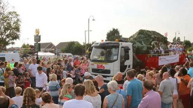 Float passes through large crowd