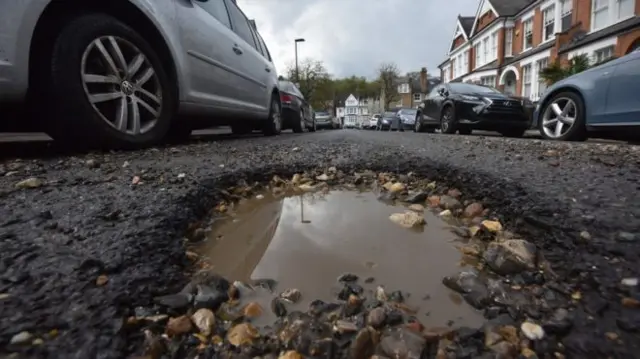 Pothole in road