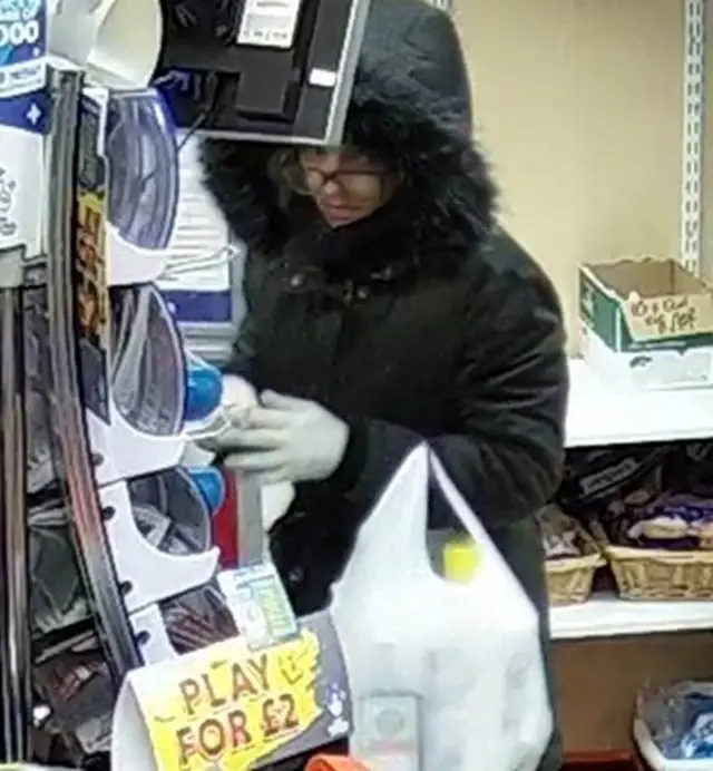 hooded woman in shop