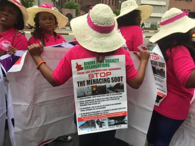 A woman wearing a poster during the march