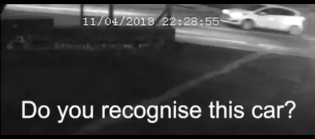 CCTV still of a white car on a road