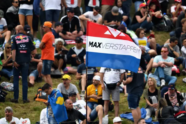 Max Verstappen fans wave a flag