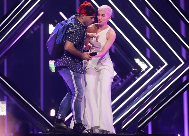 SuRie stage invasion