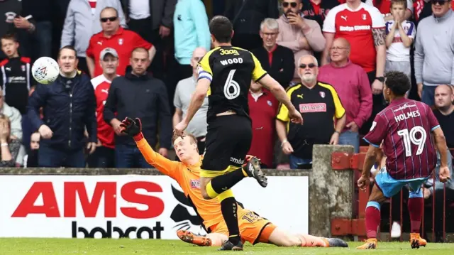 Duane Holmes chips goalwards