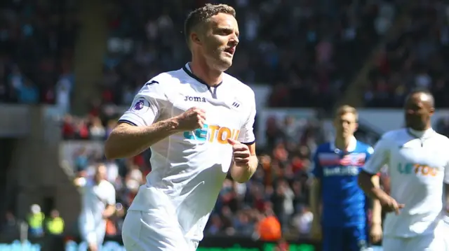 Andy King celebrates