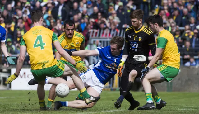 Cavan's Padraig Faulkner attempts a shot on the Donegal goal