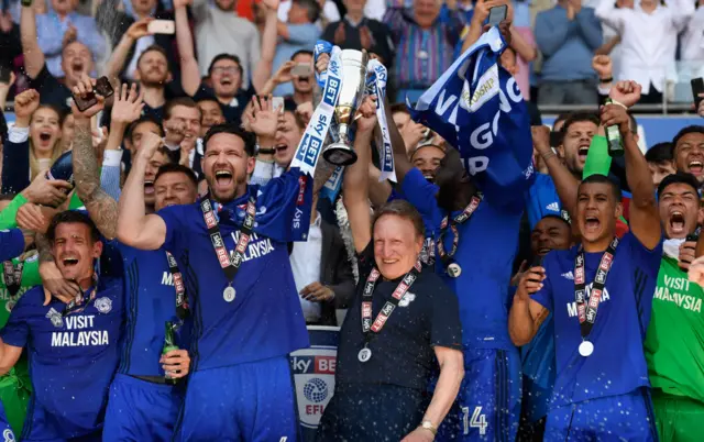 Cardiff captain Sean Morrison (l) and manager Neil Warnock celebrate promotion to the Premier League