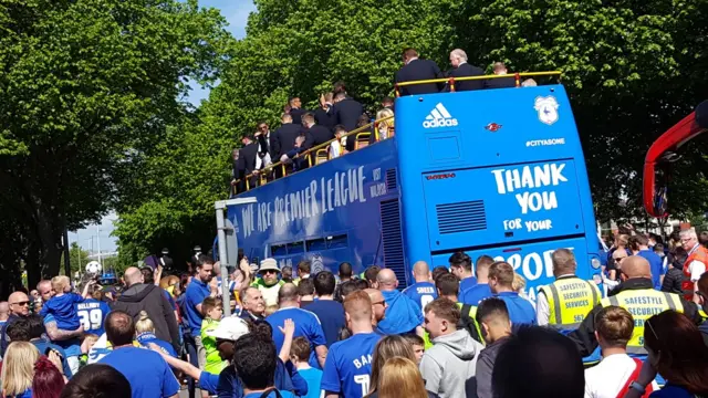 Bus making its way through the crowds