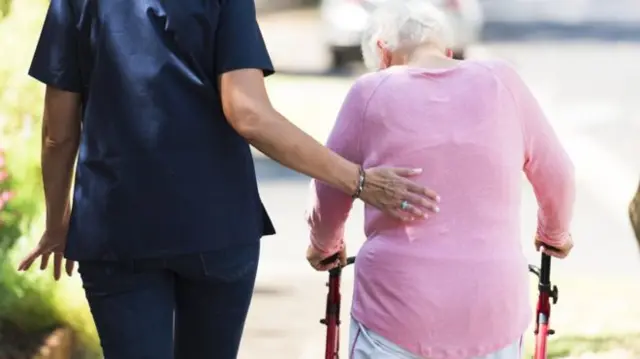 Older lady with nurse