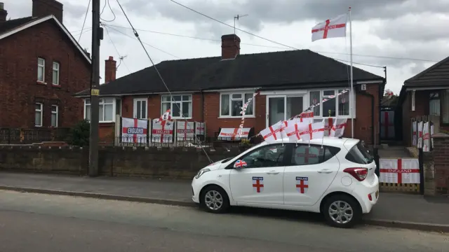 House covered in flags