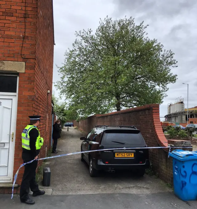 Police officer guards cordon