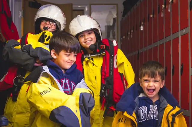 Alyasar, Qais, Yussra and Joseph on their visit to Tower Lifeboat Station