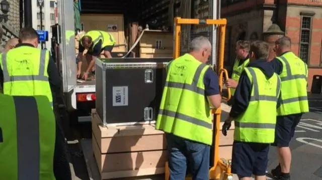 Dinosaur parts being unpacked