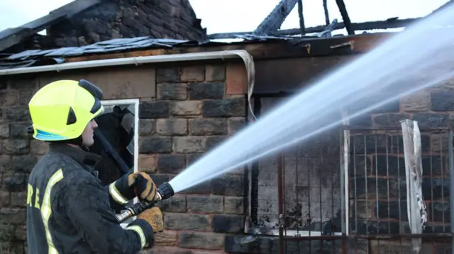 Firefighter at barn