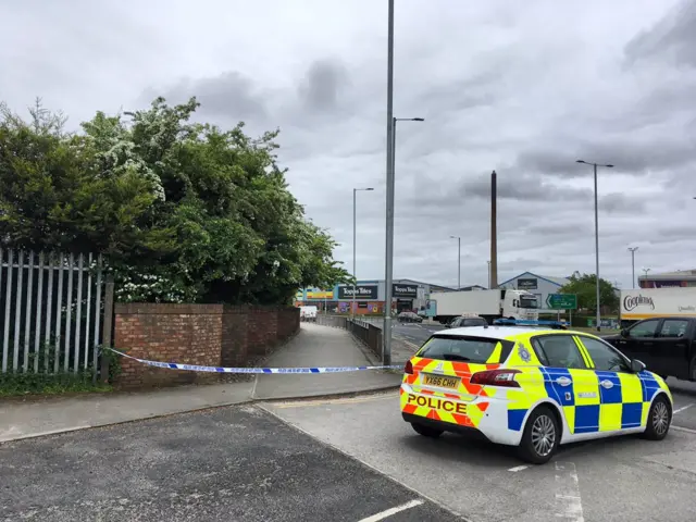 Police car and cordon