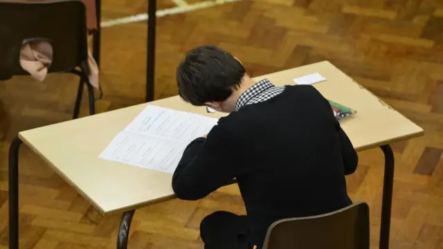 A school pupil taking his exams