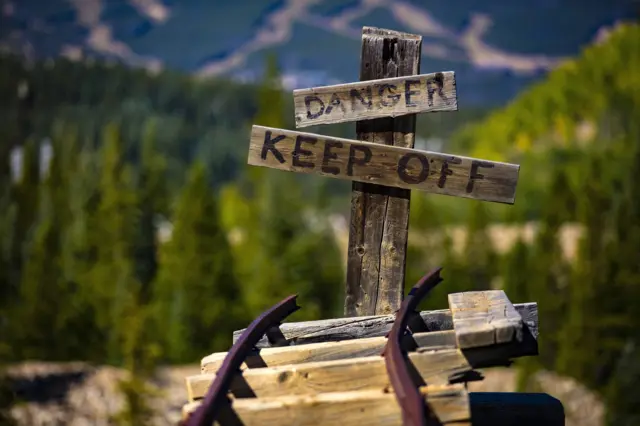 Dangers signs next to a rail track