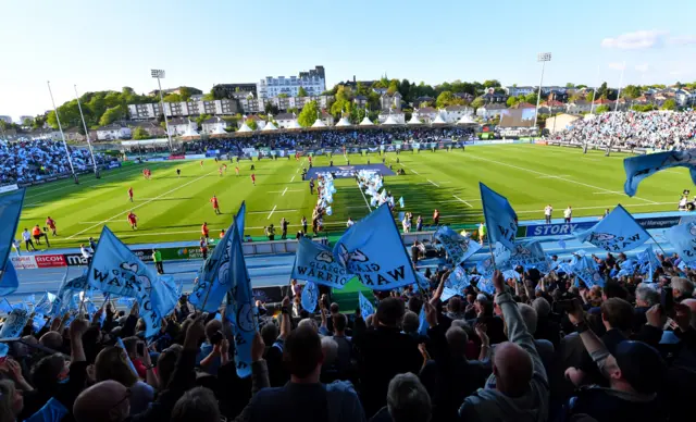 A packed crowd greets the teams at Scotstoun