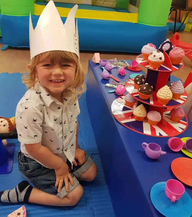 Toddler with play 'wedding breakfast'