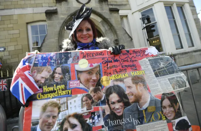 Woman with giant Harry and Meghan collage