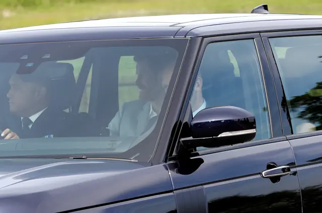 Meghan Markle and Prince Harry in their car arriving at Windsor Castle