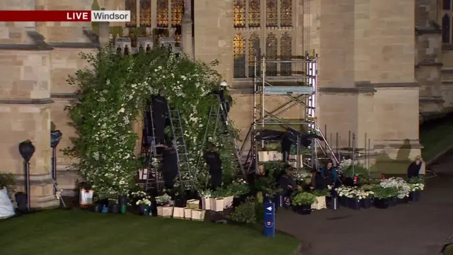 A floral arch being constructed outside St George's Chapel, Windsor