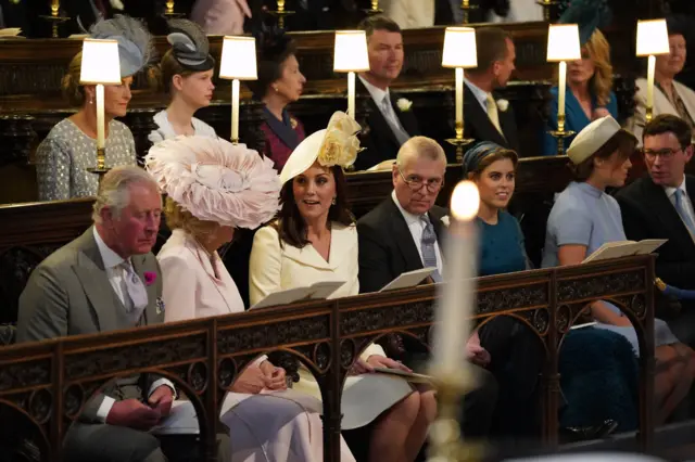 The Duchess of Cornwall and Duchess of Cambridge speak to each other during the ceremony