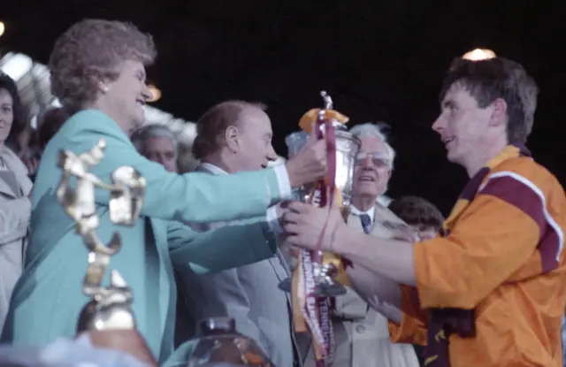 Tom Boyd receives the Scottish Cup as Motherwell captain in 1991