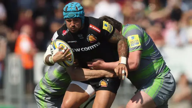 Jack Nowell is tackled by Newcastle players